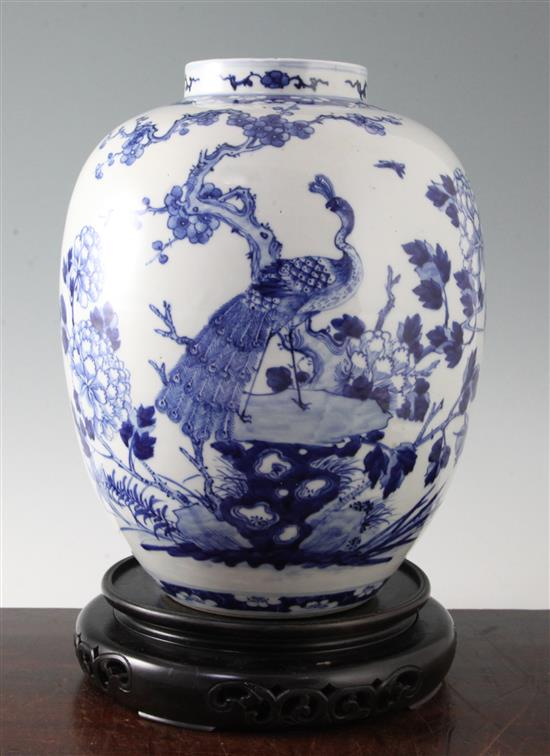 A Chinese blue and white ovoid jar, Kangxi mark, late 19th century, 32cm, wood stand